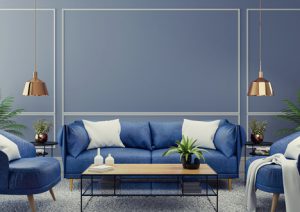 a sitting area in a home with dark blue walls and blue furniture