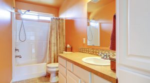 residential bathroom painted bright orange