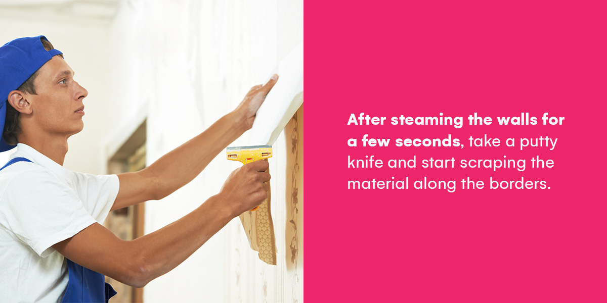 after steaming the walls for a few seconds, take a putty knife and start scraping the material along the borders