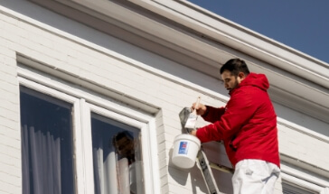 Rent Painters crew painting the exterior of a home